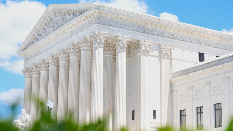 A statue titled the "Authority of Law" sits in front of the Supreme Court on Friday, May 15,...