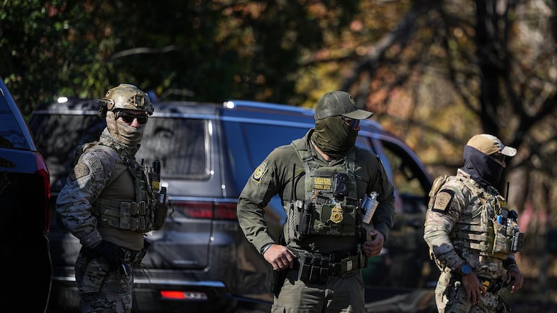U.S. Border Patrol agents look on, Monday, Nov. 17, 2025, in Charlotte, N.C. (AP Photo/Matt...