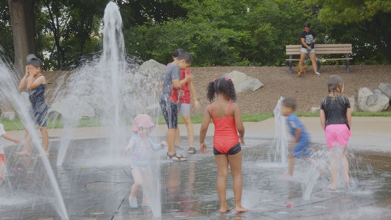 Families played in the fountain at Jordan Valley Park
